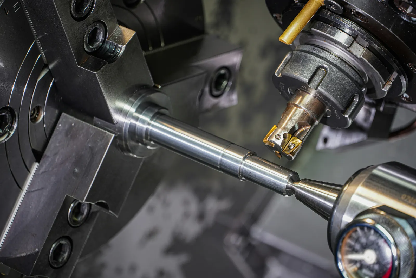 5-axis precision machining spindle cutting an angled metal workpiece